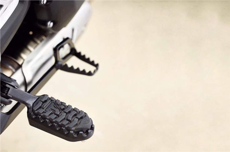 The Scrambler 400 X gets more off-road-friendly footpegs and brake lever.
